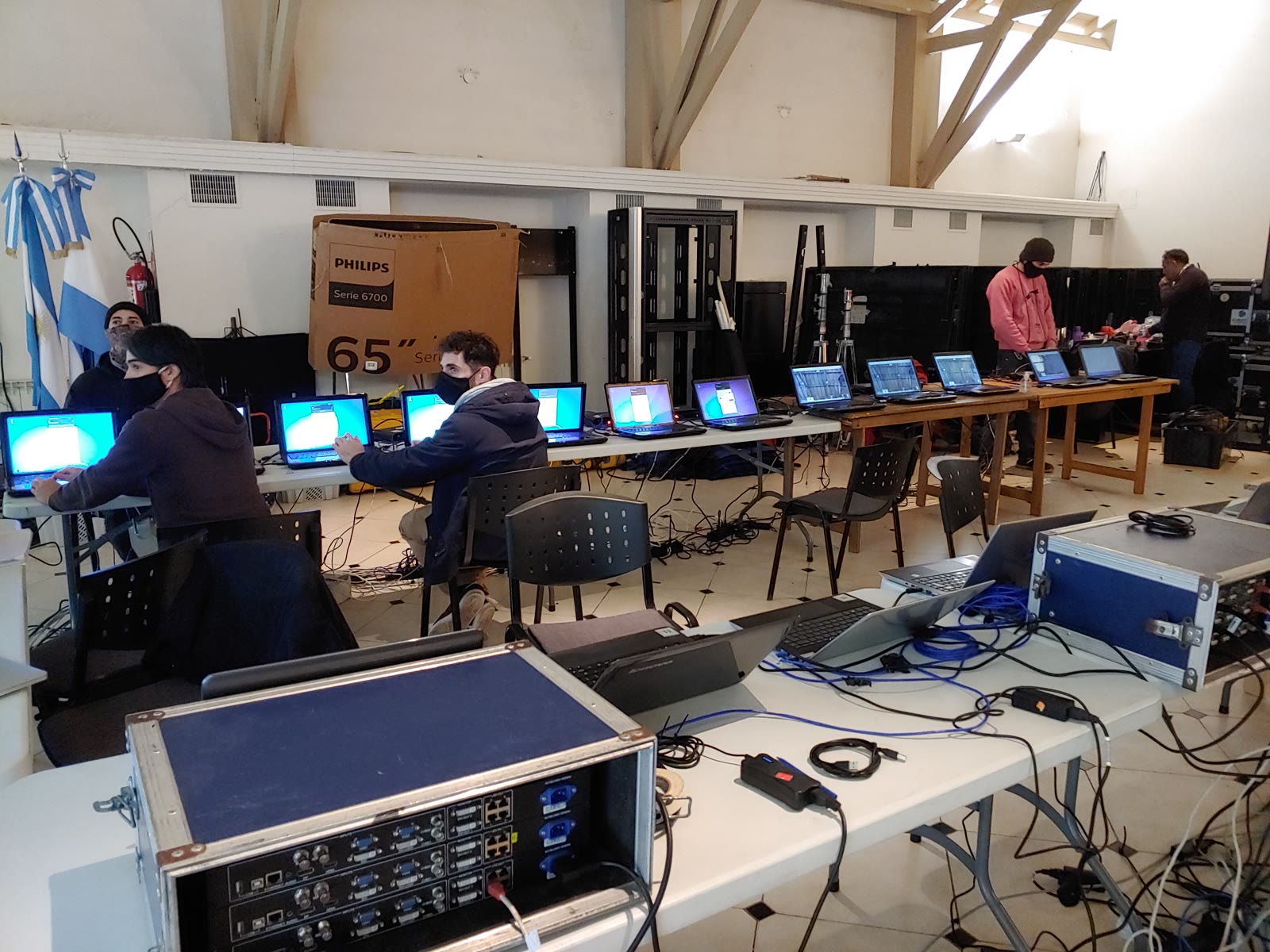 Computers and video-control position during videoconference preparation.