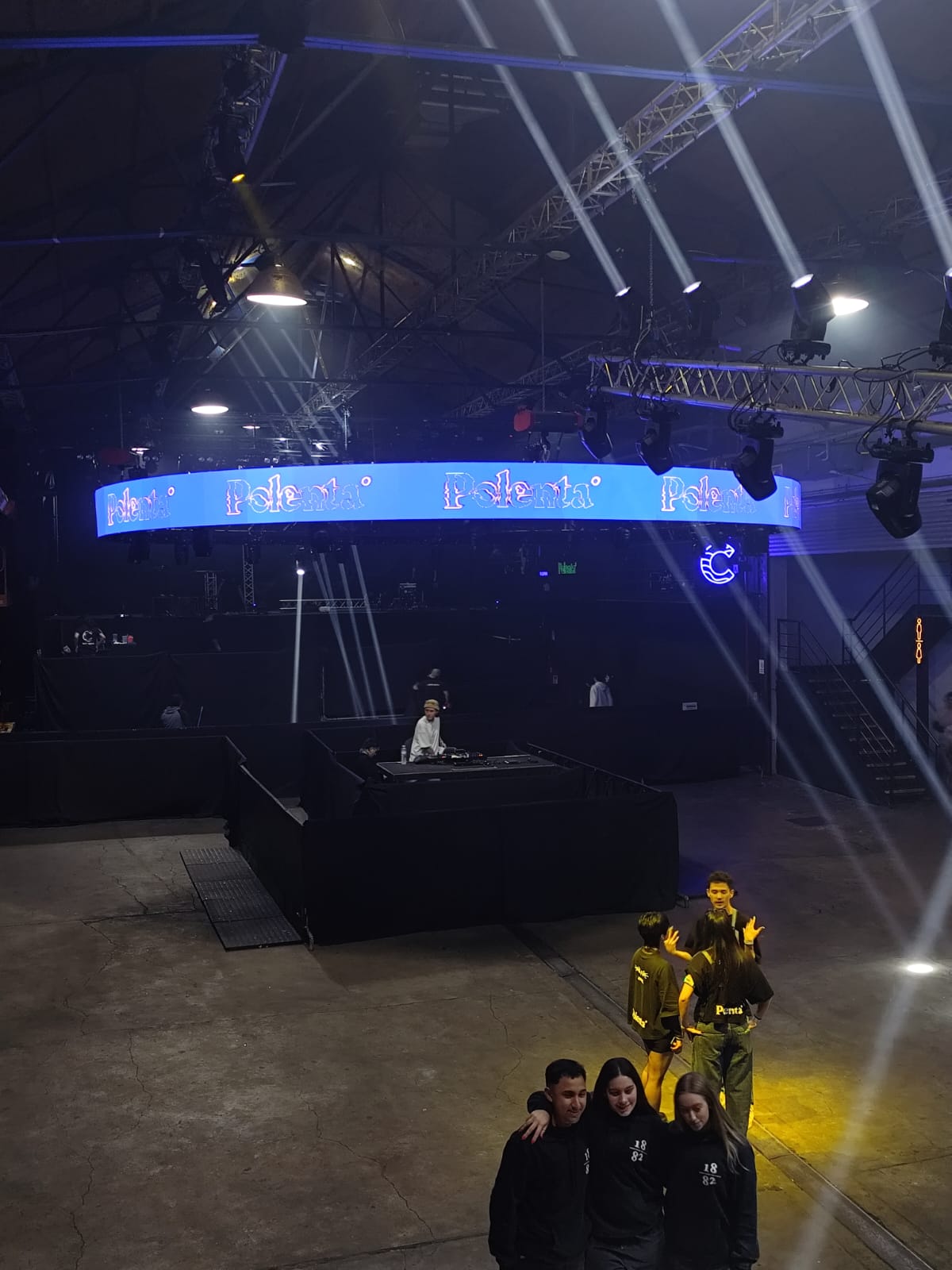 Elevated curved LED band above the activity area.