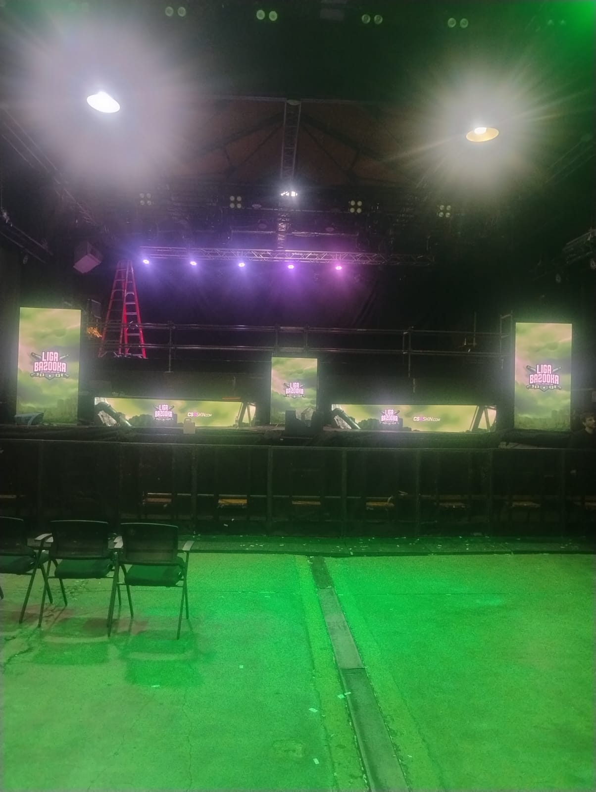 LED composition with two side totems, a central display and two horizontal bands.